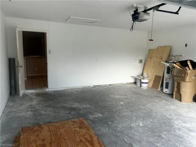 Garage with a garage door opener and water heater