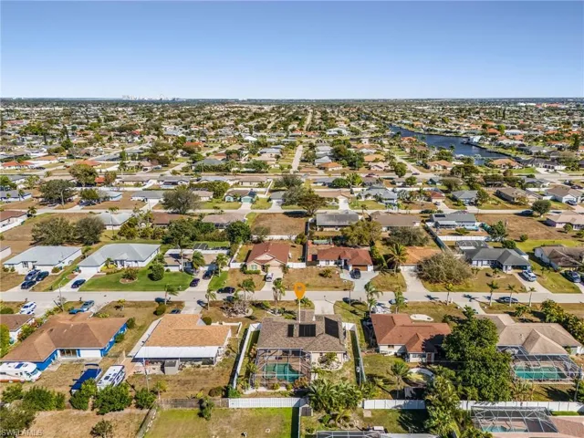 Aerial overview of property's location featuring nearby suburban area