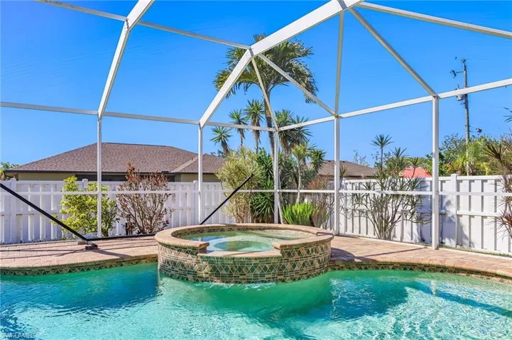 Integrated pool / hot tub with a lanai and a sunroom
