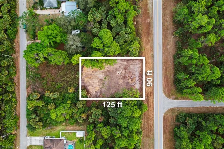 Aerial view of property's location featuring property parcel outlined