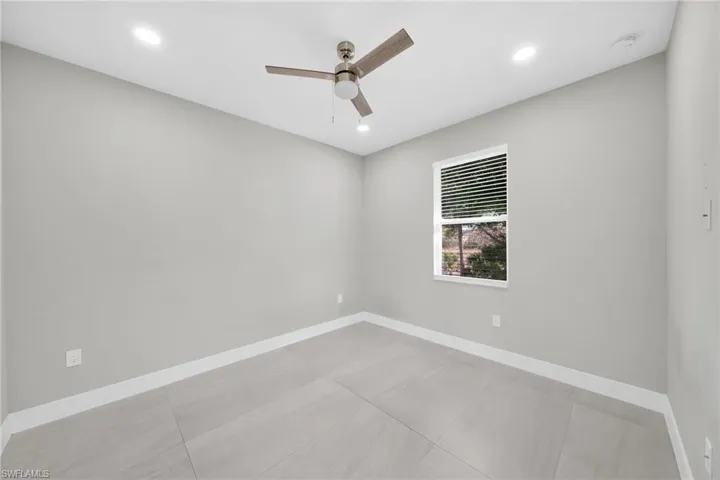 Empty room featuring recessed lighting and a ceiling fan