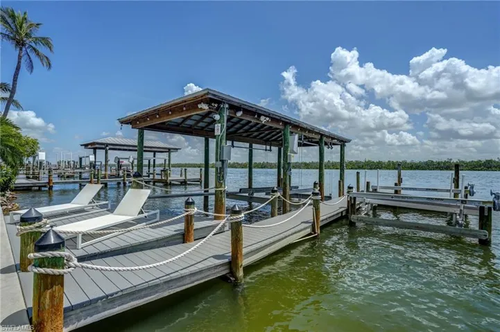 25,000 lbs boat lift & boat house with a jet ski liftVirtually Edited