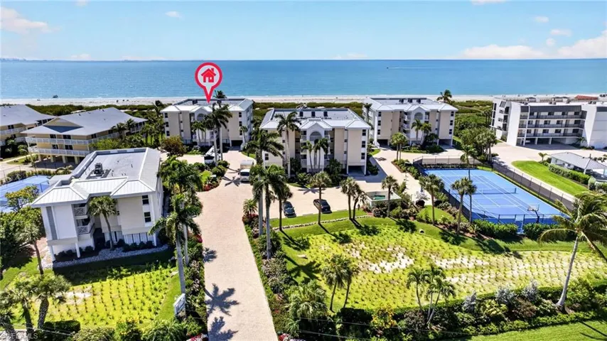 The property is situated directly on the beachfront, offering expansive views of the ocean