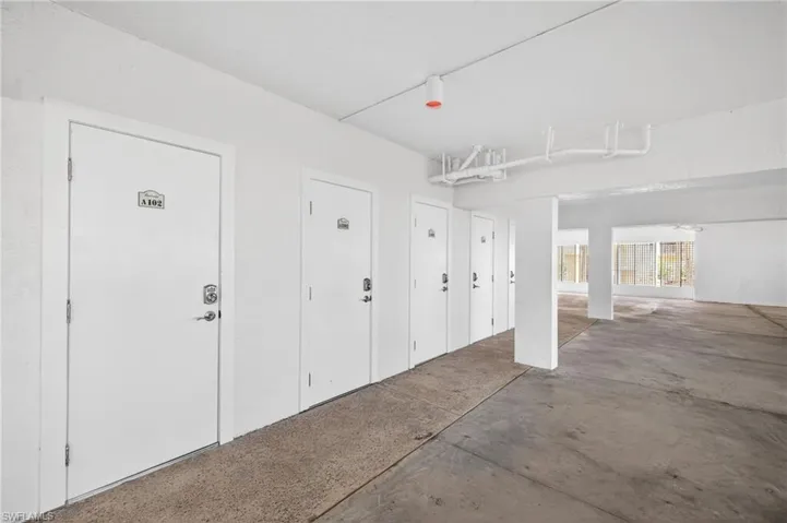 Storage area featuring a concrete floor and white painted walls
