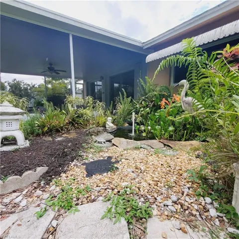 View of yard featuring ceiling fan