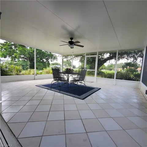 View of patio with ceiling fan and outdoor dining space