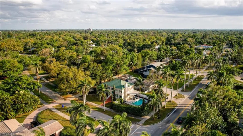 Birds eye view of property with a forest view