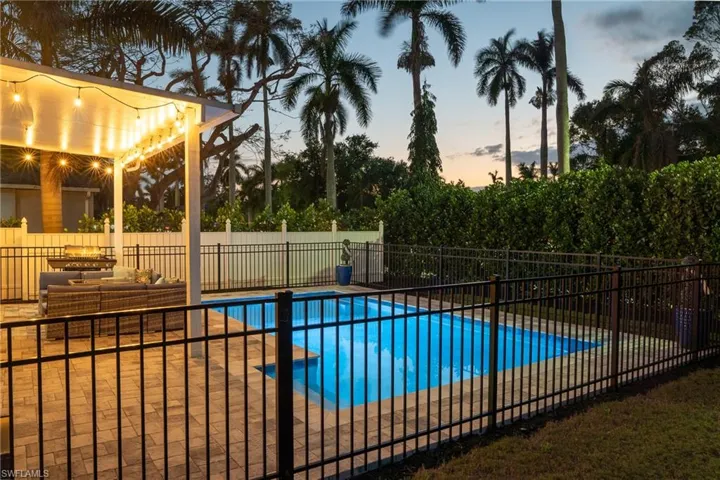 View of pool with a fenced in pool, a patio, and a fenced backyard