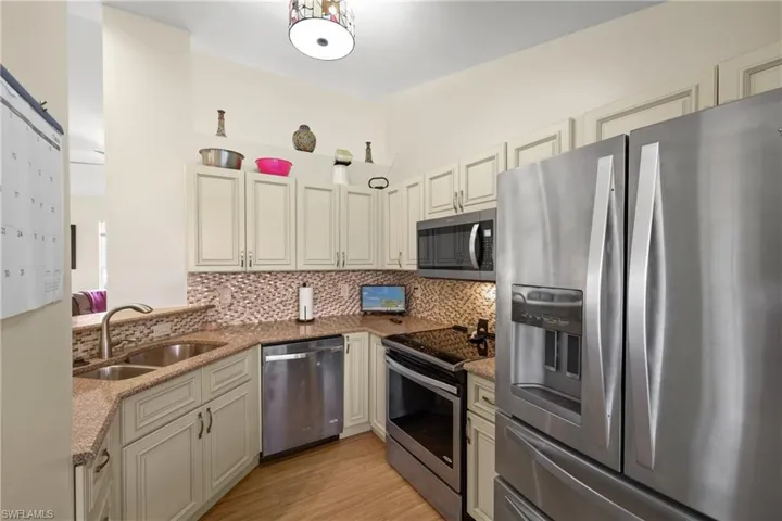 Kitchen view from Nook w/Stainless Steel Appliance Package