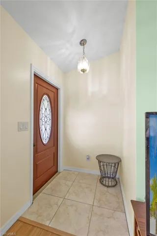 New Impact rated Front Door w/Tiled foyer entrance