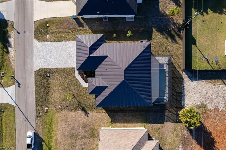 Designed for MODERN FLORIDA LIVING, this CONTEMPORARY LUXURY HOME features SCREENED, HEATED POOL & SPA, perfect for year-round enjoyment!
