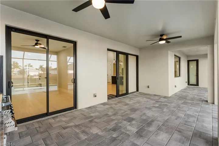 PAVER FLOORING & CEILING FAN create COMFORTABLE SPACE for YEAR-ROUND ENJOYMENT.
