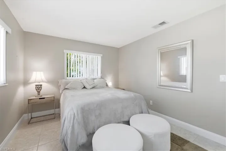 Bedroom with light tile patterned floors