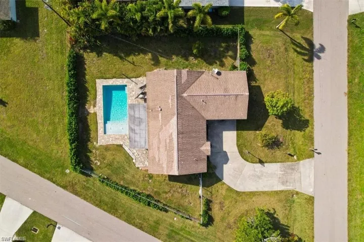 View from above of property featuring a pool area