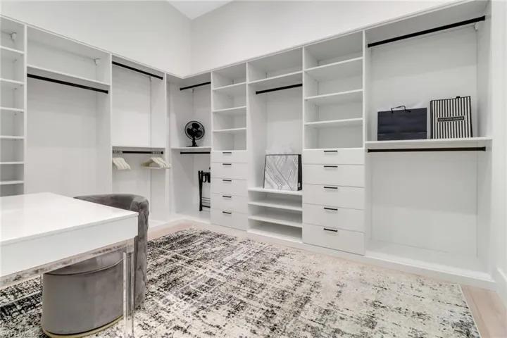 Walk in closet featuring wood-type flooring