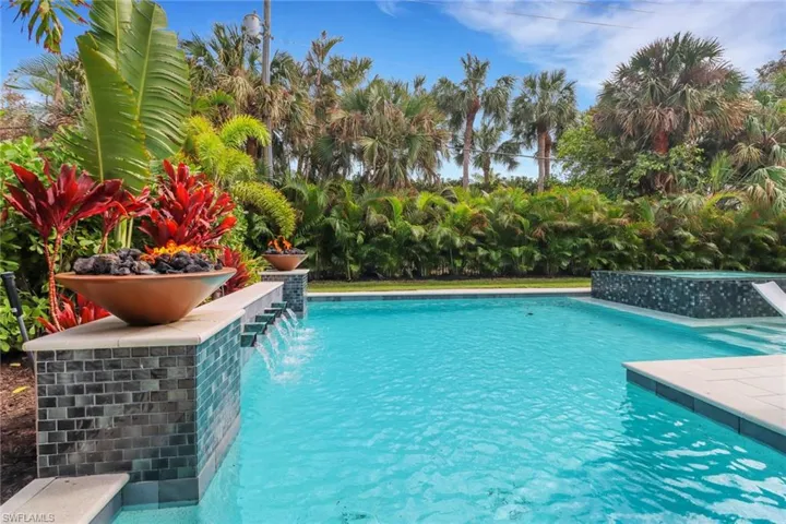 View of swimming pool with pool water feature