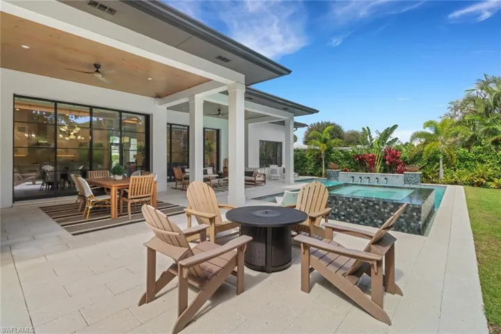 View of patio / terrace with an in ground hot tub and ceiling fan
