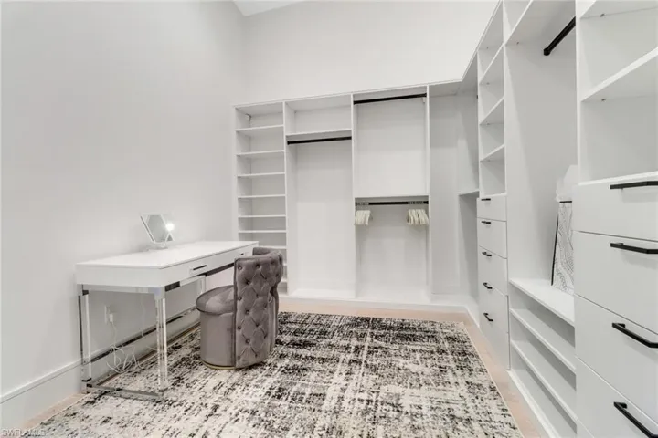Spacious closet featuring wood-type flooring