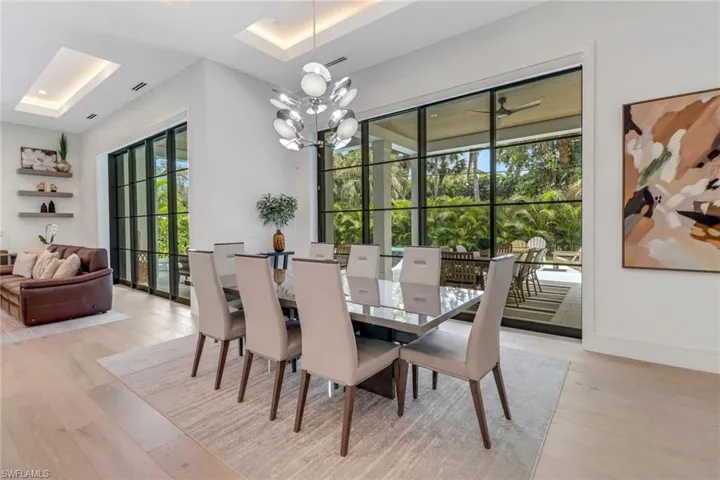 Dining area featuring light hardwood / wood-style floors and a notable chandelier
