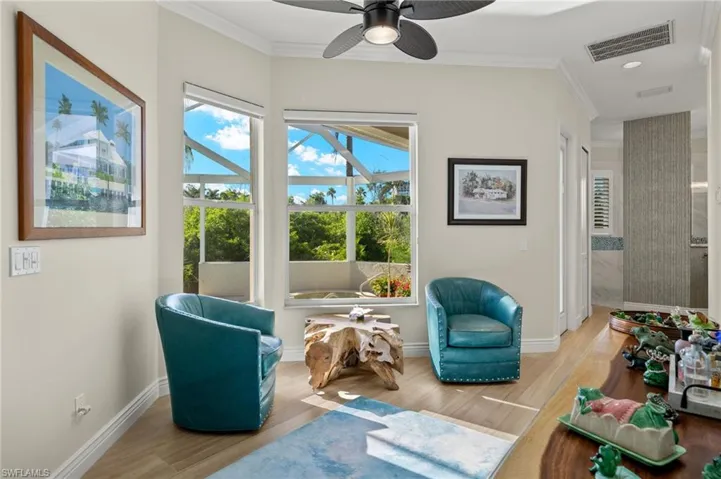 Sitting room with ceiling fan, light hardwood / wood-style flooring, and ornamental molding