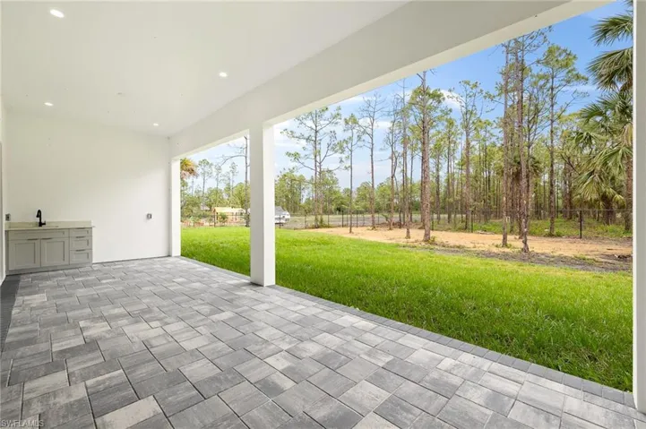 View of patio / terrace with a sink and fence
