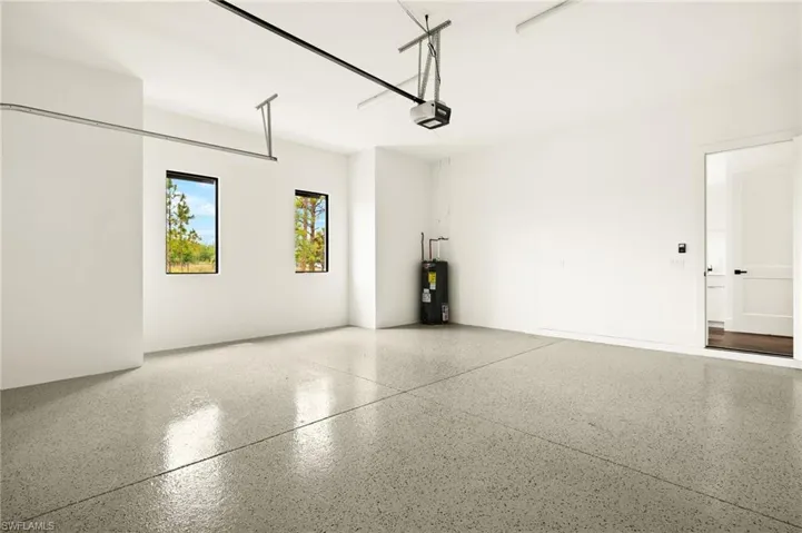 Garage with water heater and a garage door opener