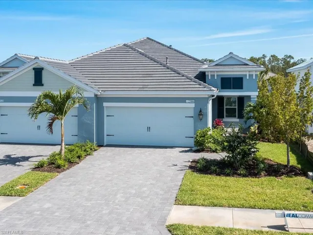 Light blue stucco exterior with a gray tile roof