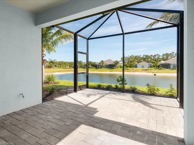Screened patio with paver flooring, stucco exterior, and a water feature
