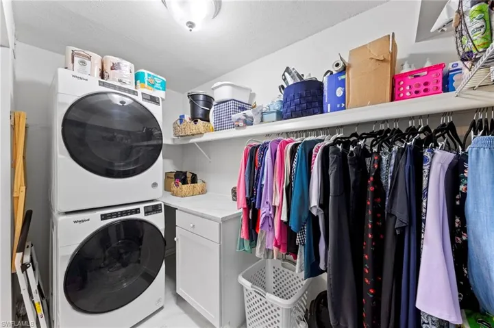 Primary closet with laundry