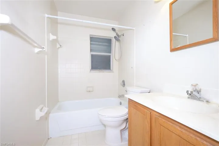 Guest bathroom with vanity and tub / shower combination