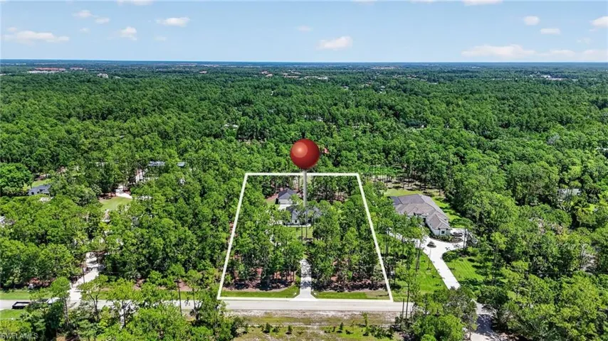 Expansive parcel outlined in white, featuring dense natural tree coverage
