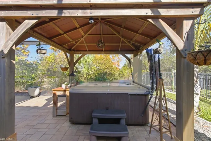 View of patio featuring a gazebo and a hot tub