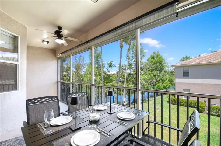 Sunroom featuring ceiling fan and outdoor dining area