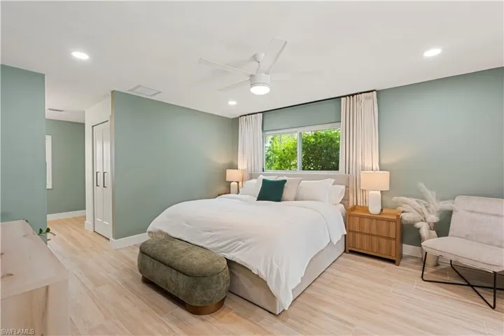 Bedroom with recessed lighting, light wood-type flooring, and a ceiling fan