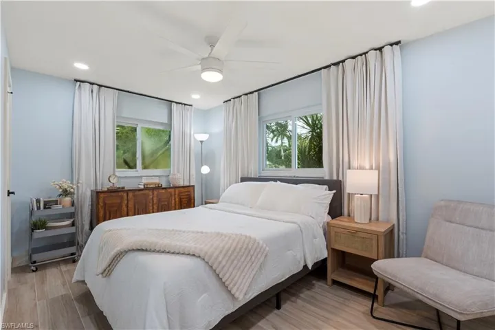 Bedroom with recessed lighting, light wood-style floors, and a ceiling fan