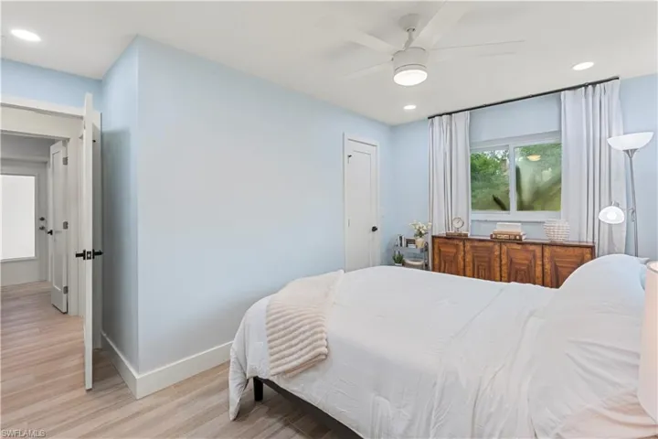 Bedroom featuring recessed lighting, wood finished floors, and a ceiling fan