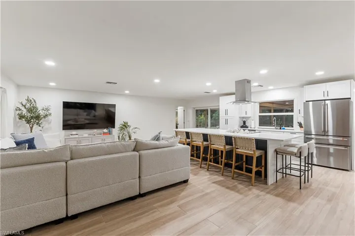 Living area featuring recessed lighting and light wood-style floors