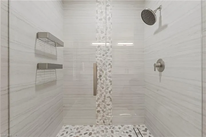 Full bath with a shower stall