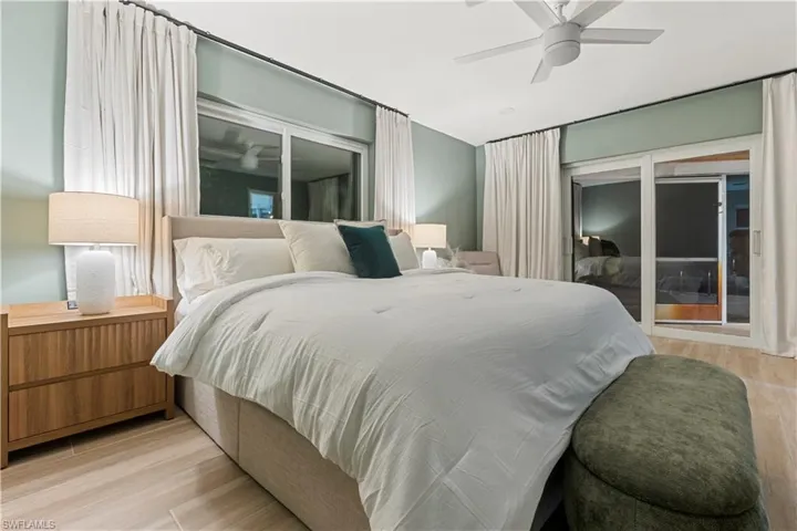 Bedroom with light wood-style floors and a ceiling fan