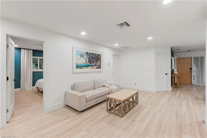 Living area featuring recessed lighting and light wood finished floors