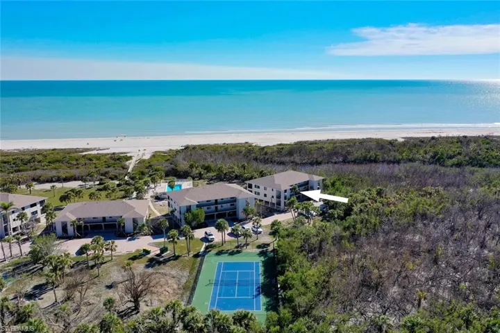 Coastal condominium building with balconies overlooking the beach and Gulf of Mexico