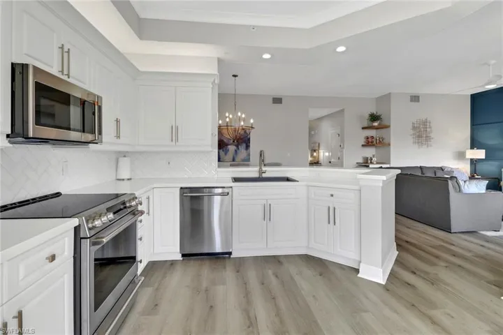 Kitchen featuring a peninsula, stainless steel appliances, and recessed lighting