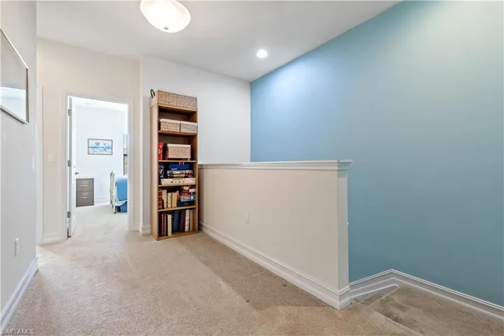 Second floor landing cove with light carpet
