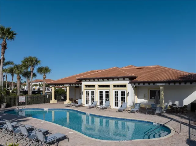 View of pool featuring french doors and a patio