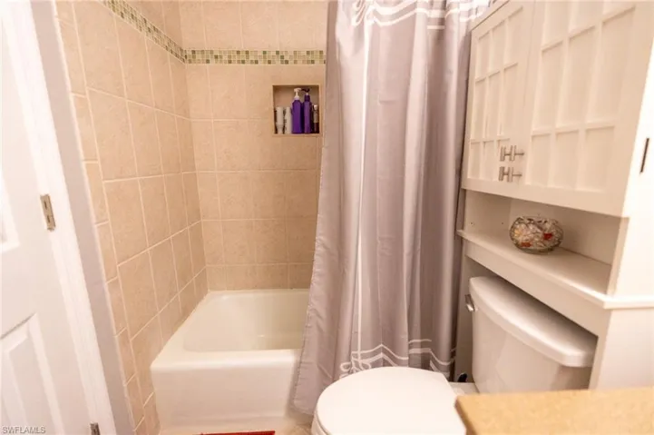 Updated second floor full bath with designer tiles.