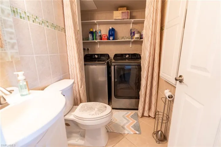Full Laundry in first floor half bath.  Clean and bright.
