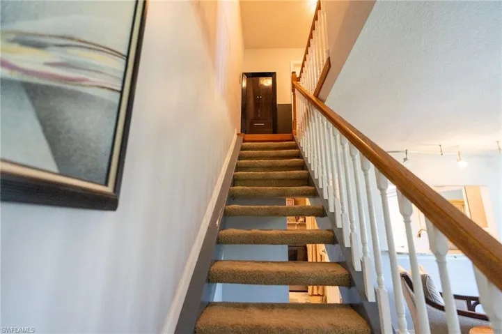 Updated staircase to second floor bedrooms.