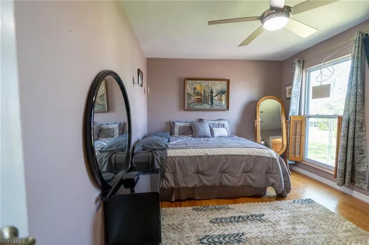 Beautiful light and airy master bedroom with walk-in closet.