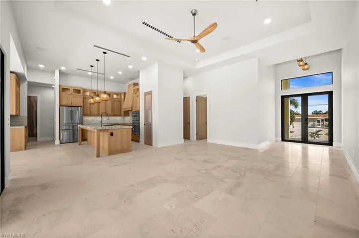 View from living to front entry/kitchen