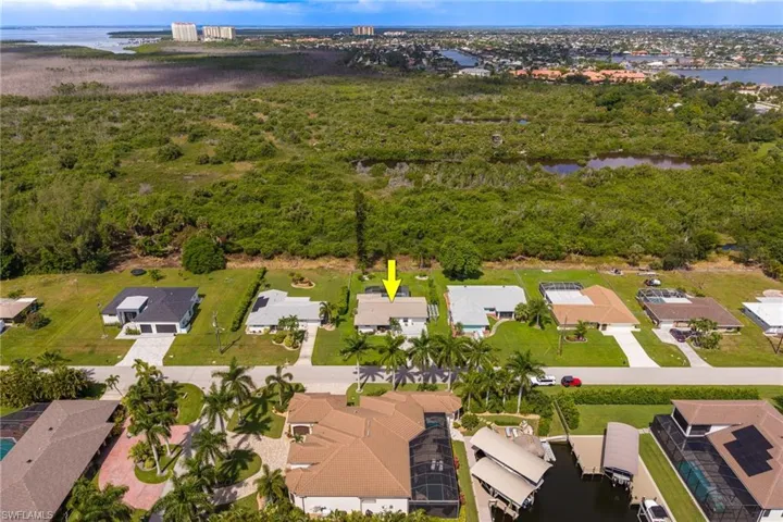 Waterfront community setting with residential properties and boat access
